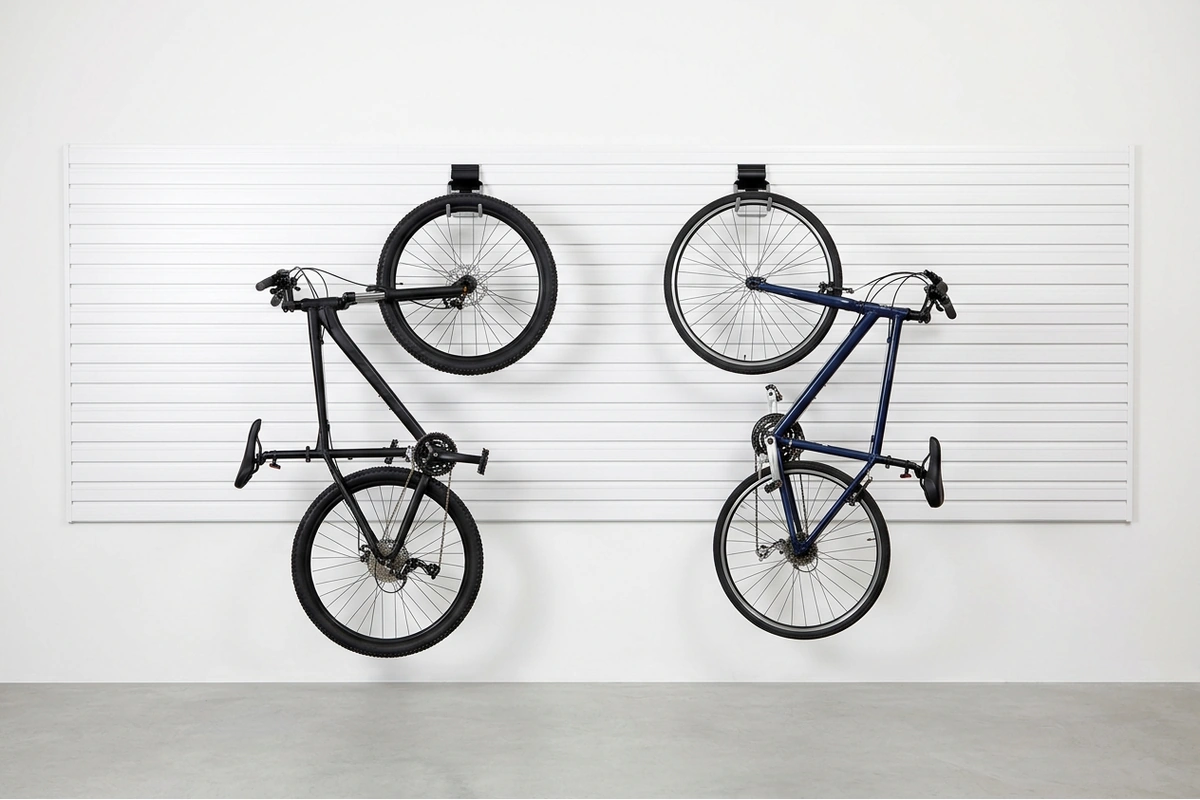 Two bicycles stored vertically on NorskWall with vertical bike hooks, front wheels off the floor, freeing garage floor space