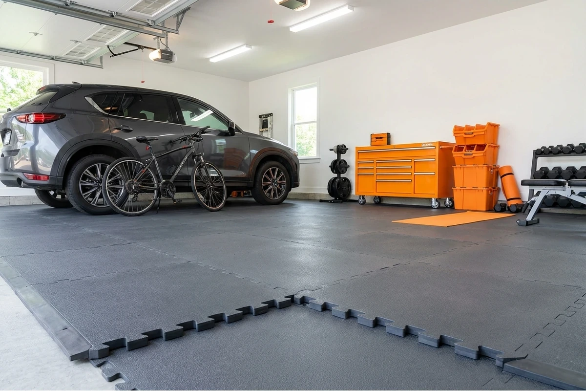 Durable garage flooring: interlocking PVC tiles handling daily vehicle parking and tire loads