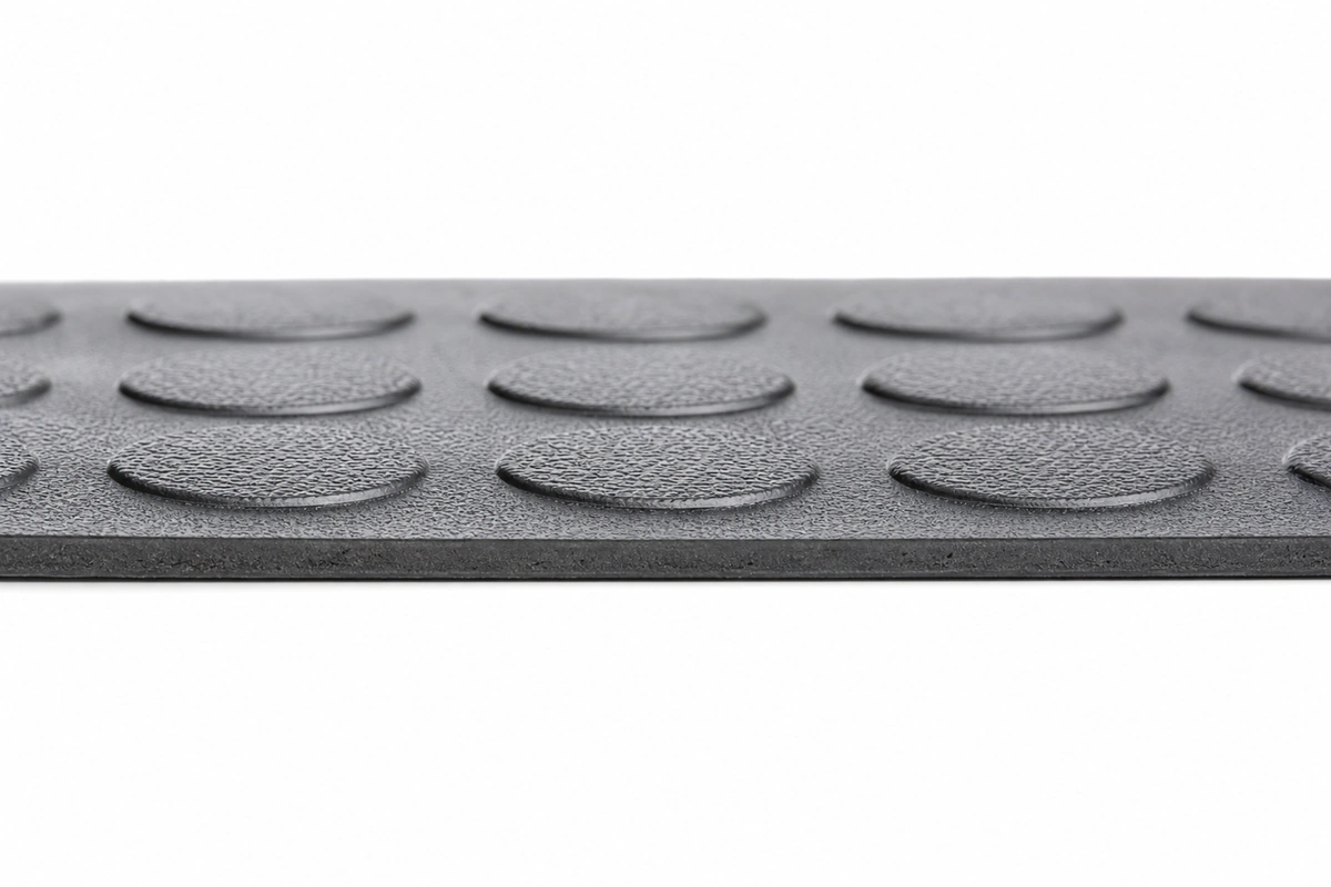 Close-up of Raised Coin texture showing slip-resistant surface pattern