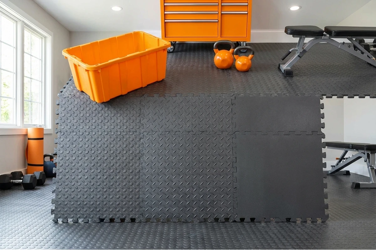 Garage flooring texture comparison: Raised Coin vs Diamond pattern PVC tiles for traction and cleaning